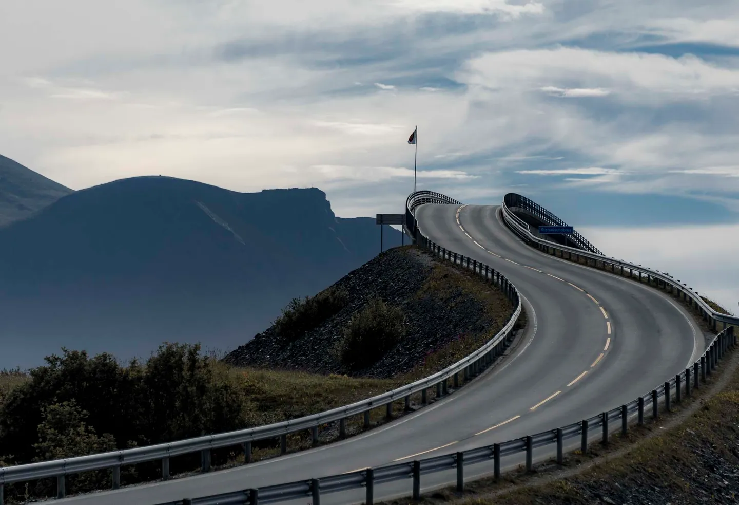 The Atlantic Ocean Road crossing low islands along the Norwegian coast.
