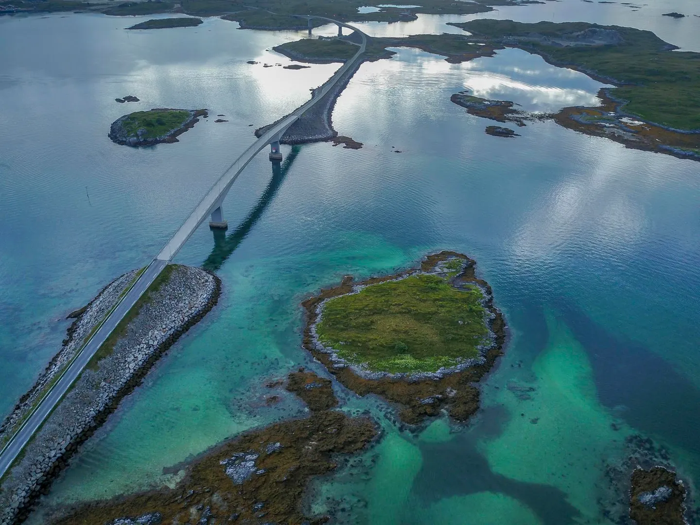 The E10 highway winding through the dramatic landscape of Lofoten.