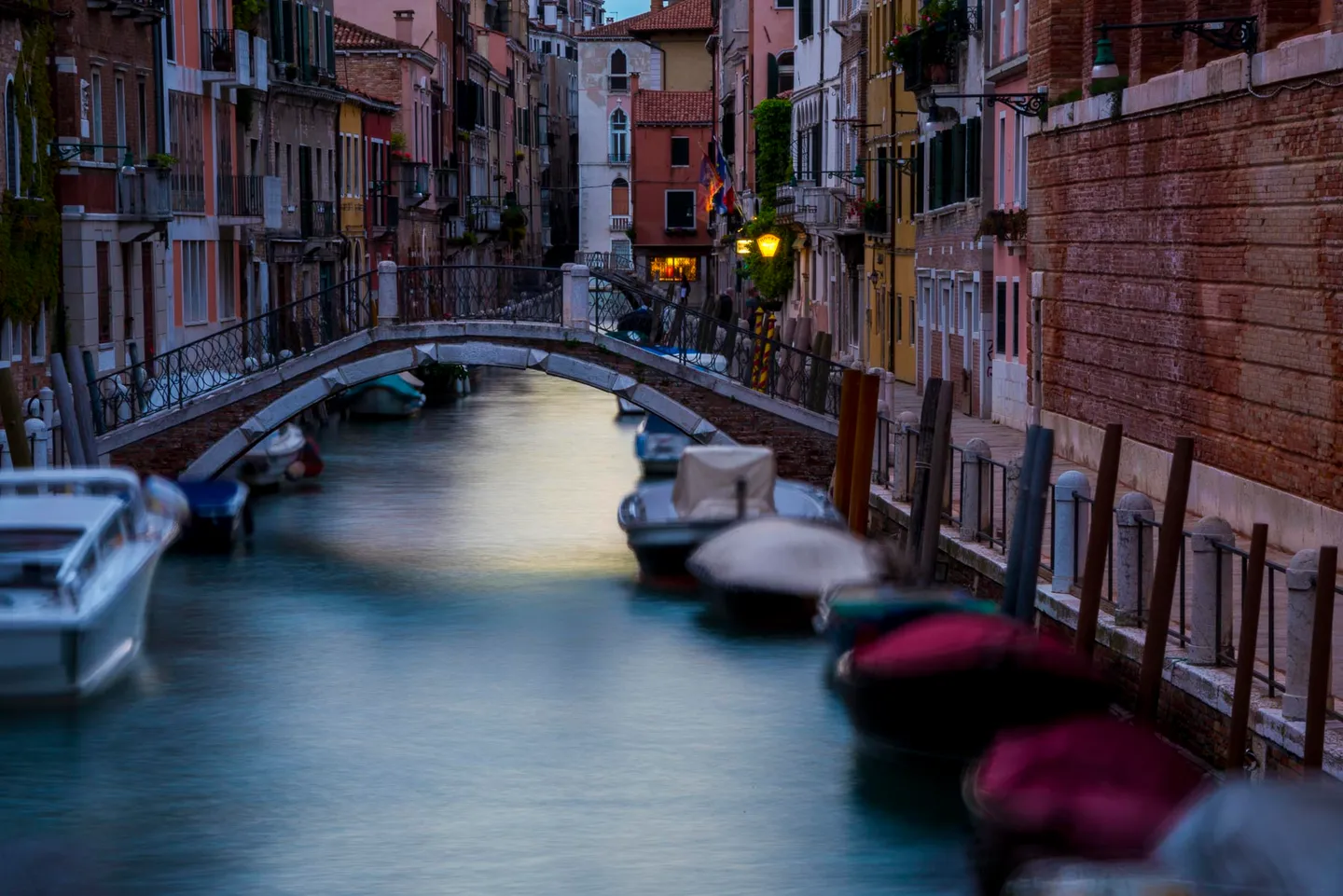 A street and canal scene in Venice.