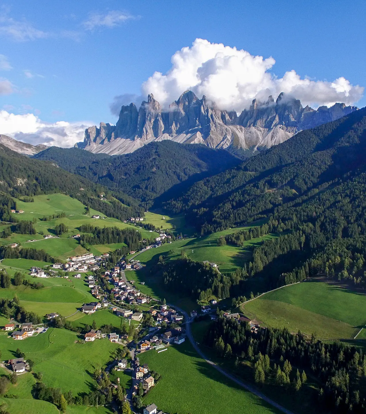 Val di Funes beneath the jagged Odle peaks in the Dolomites.